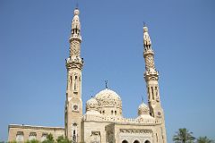 
The Jumeirah Mosque has a massive central dome where non-Muslims can visit as part of the ‘Open Doors, Open Minds’ cultural understanding program. It is an exact copy of a mosque in Cairo that is eight times its size. This stone structure is built in the medieval Fatimid tradition with two minarets that display the subtle details in the stonework. The minaret is the tower from which the call to prayer is broadcast five times a day.
